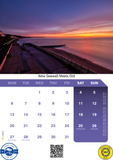 Calendar with a scenic sunset over a beach and seawall, featuring the month of December 2023.
