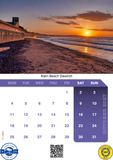 Calendar with a beach sunset scene and October 2023 dates.